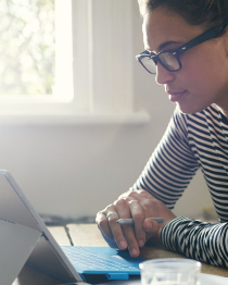 Woman browsing on her laptop