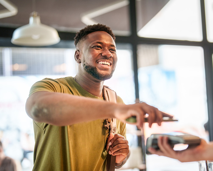 Person paying bill with their phone.