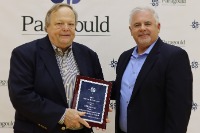 Mr. Brewer accepting an award