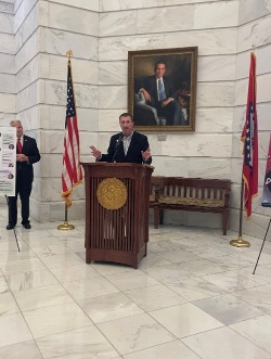 Mitch speaking in front of a crowd