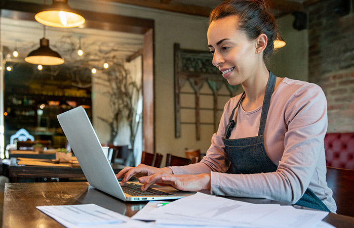 Small business owner on laptop.