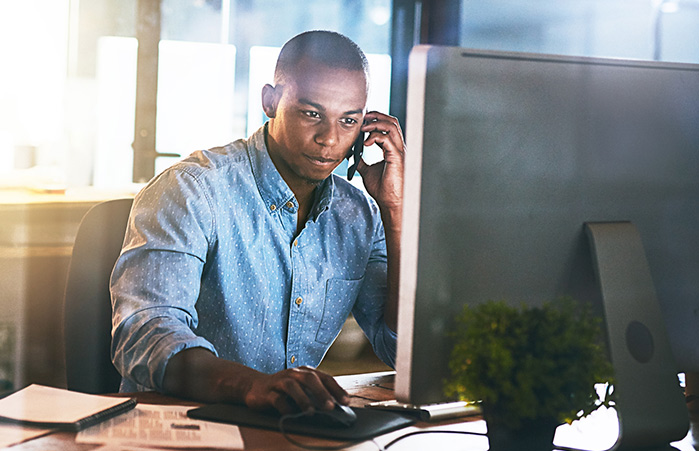 Business owner in front of their computer.