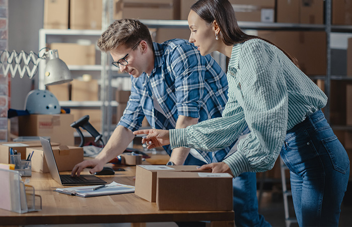 Small business owner looking at their laptop.