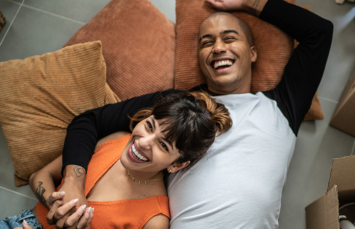 Couple embraced smiling.