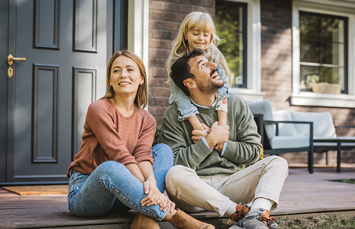 Happy family on their porch.